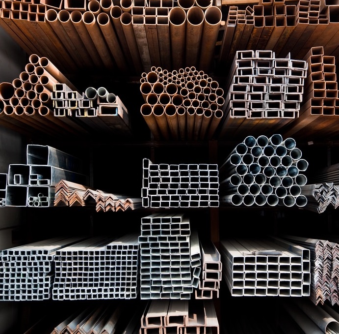 a,series,of,different,sizes,metal,pipes,on,shelf